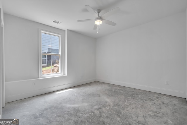 empty room featuring concrete flooring and ceiling fan