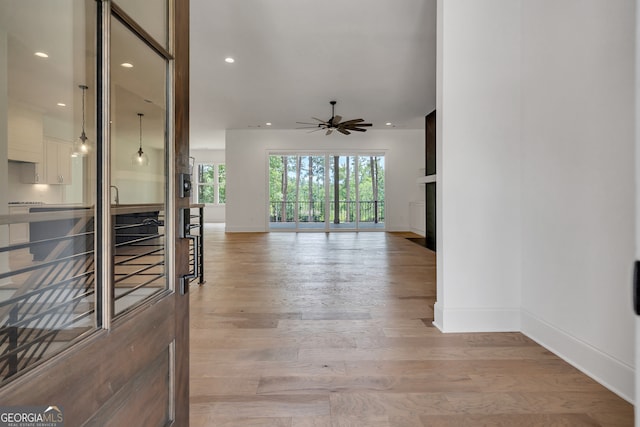 corridor featuring light hardwood / wood-style floors