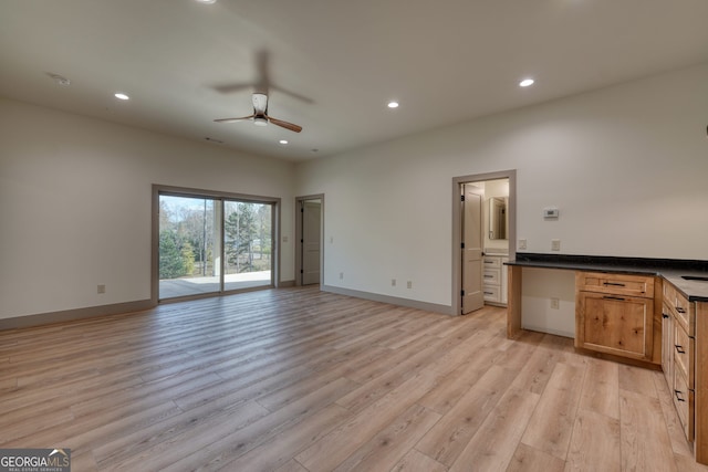 unfurnished living room with light hardwood / wood-style floors and ceiling fan