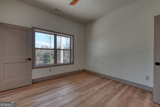 unfurnished room with light hardwood / wood-style floors and ceiling fan