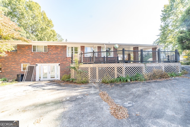 rear view of property with a deck