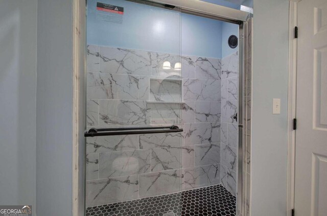 bathroom featuring an enclosed shower