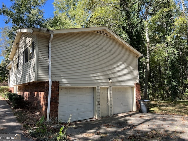 view of property exterior with a garage