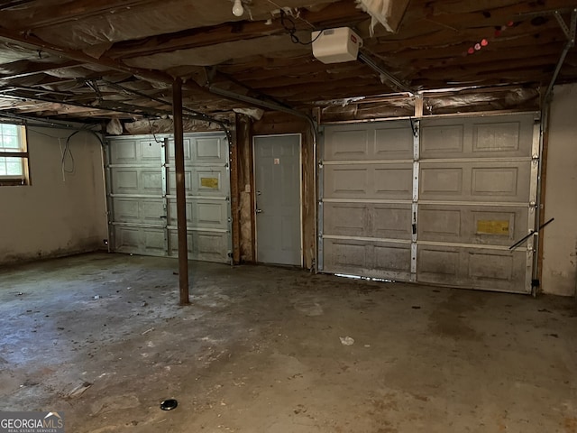 garage featuring a garage door opener