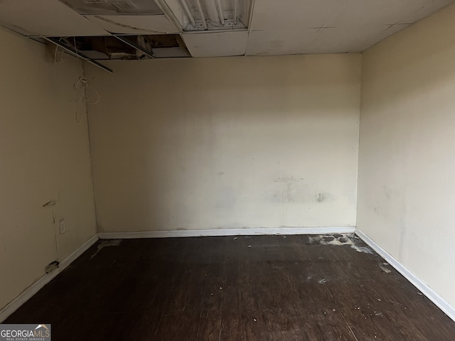 spare room featuring dark hardwood / wood-style floors