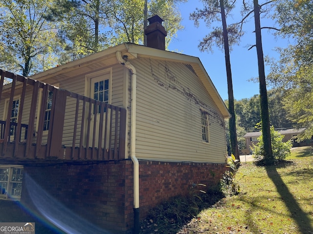 view of home's exterior with a yard