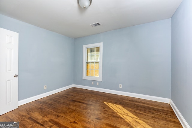 unfurnished room featuring hardwood / wood-style floors