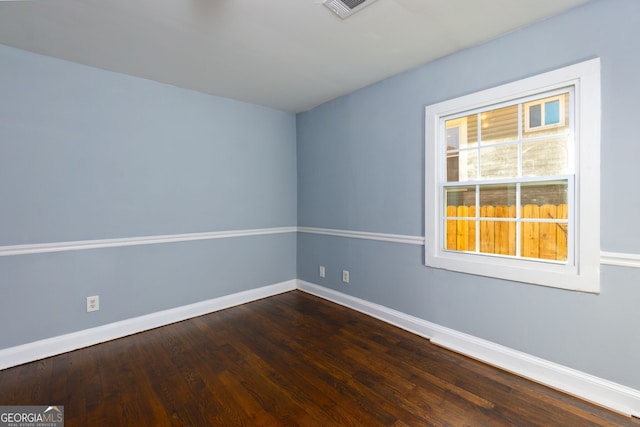 unfurnished room featuring dark hardwood / wood-style floors