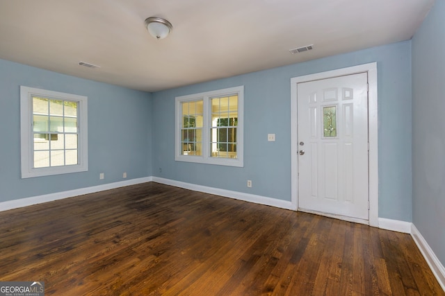 entrance foyer with dark hardwood / wood-style floors