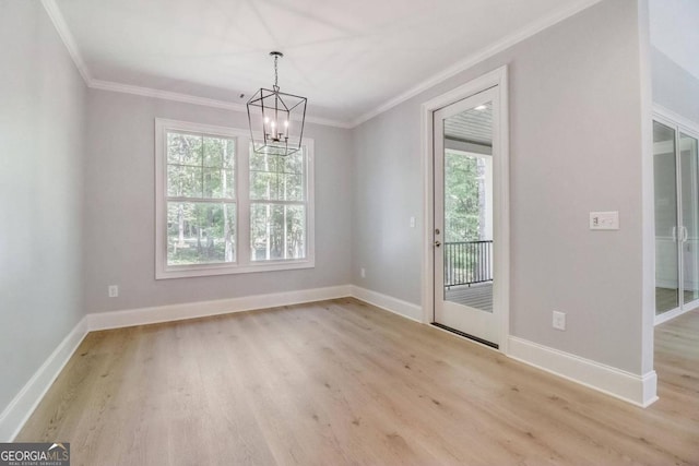 unfurnished dining area featuring ornamental molding, a chandelier, and light wood-type flooring