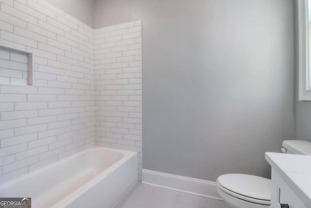 bathroom featuring tile patterned flooring, vanity, and toilet