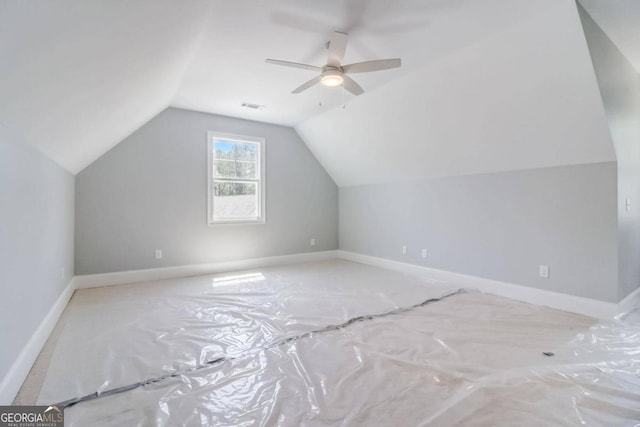 additional living space with vaulted ceiling and ceiling fan