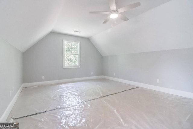 additional living space featuring lofted ceiling