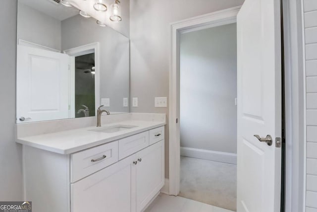 bathroom with tile patterned floors and vanity