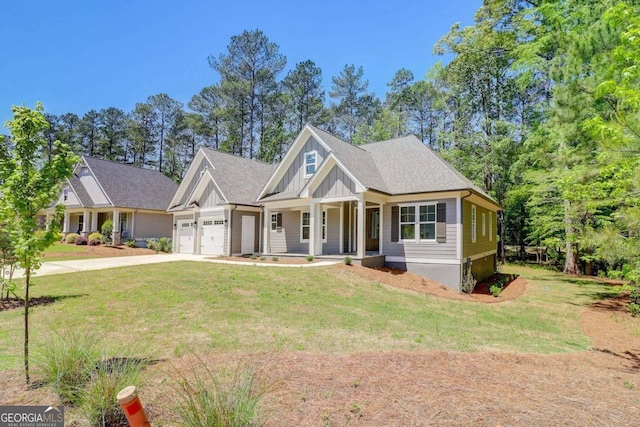 craftsman-style house with a garage, a front yard, and a porch