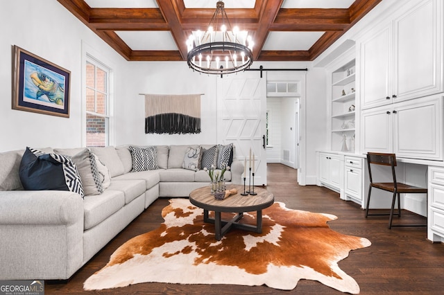 222 Valley View Dr, Rockmart, GA 30153 - living area with a barn door, built in features, dark wood-style flooring, beam ceiling, and a notable chandelier