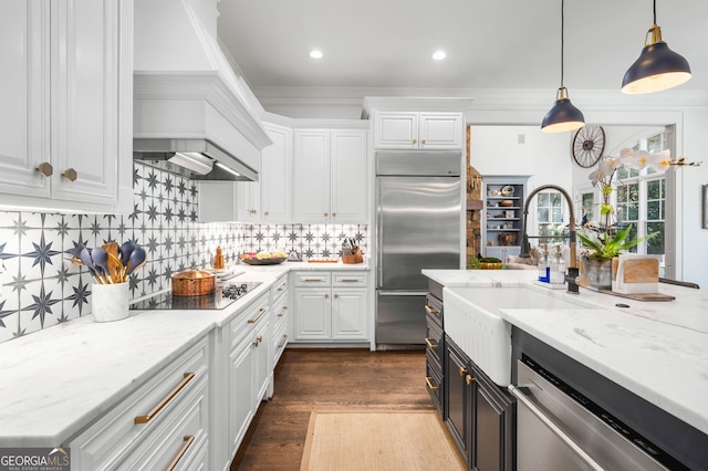 222 Valley View Dr, Rockmart, GA 30153 - kitchen featuring custom exhaust hood, hanging light fixtures, light stone counters, appliances with stainless steel finishes, and white cabinetry