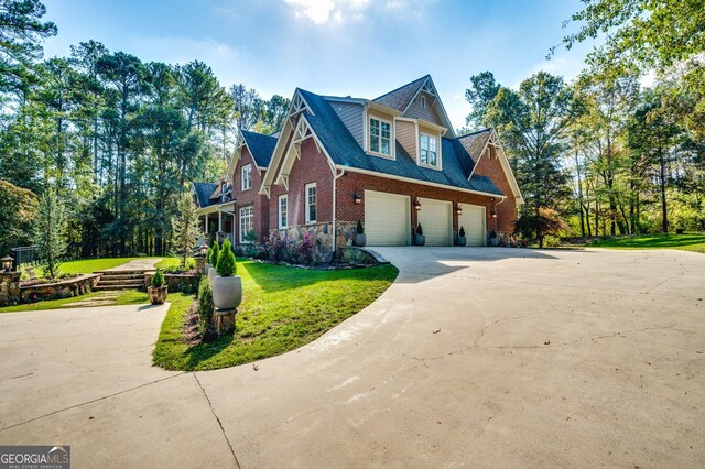 222 Valley View Dr, Rockmart, GA 30153 - view of property exterior with concrete driveway, a lawn, a garage, and brick siding