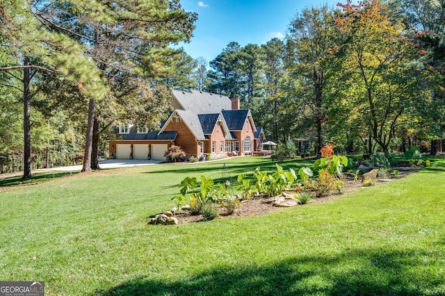 222 Valley View Dr, Rockmart, GA 30153 - exterior space featuring a chimney, a garage, concrete driveway, and a lawn