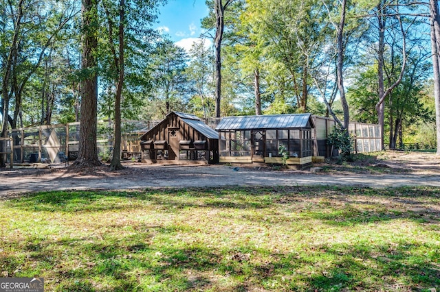 222 Valley View Dr, Rockmart, GA 30153 - view of front facade featuring an outbuilding, a front lawn, and a greenhouse