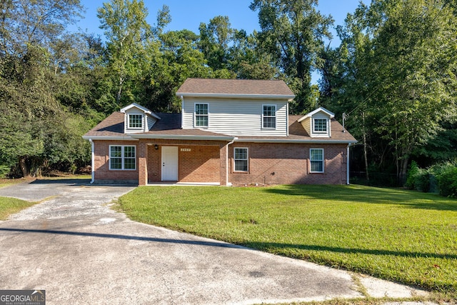 front facade with a front yard