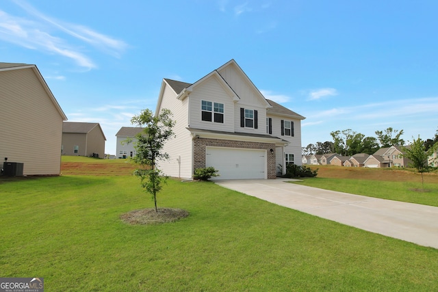 view of front of home featuring central AC, a front yard, and a garage