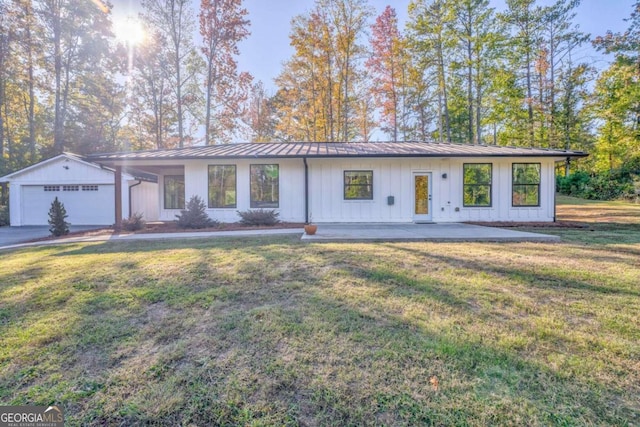 ranch-style home featuring a front yard and a garage