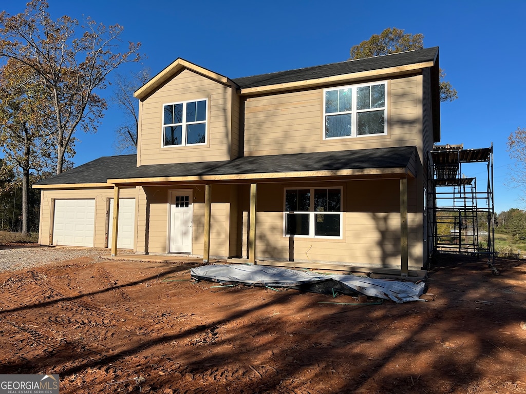 view of front of property with a garage