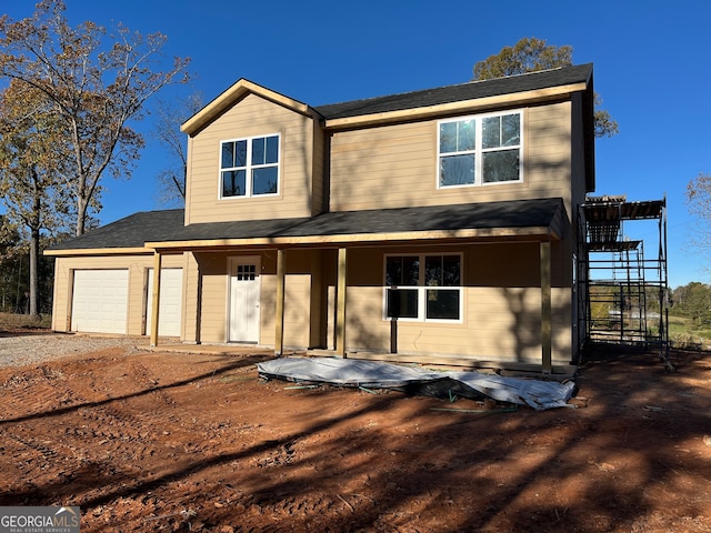 view of front of property with a garage