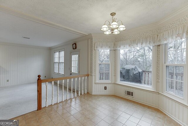 living room with crown molding, carpet, and ceiling fan with notable chandelier