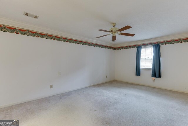 carpeted spare room featuring a textured ceiling and ceiling fan