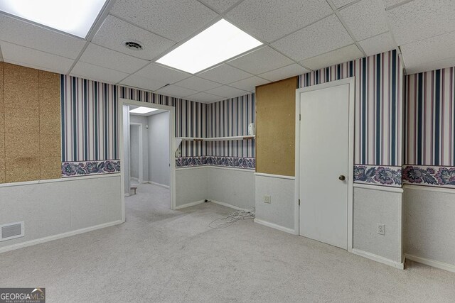 bathroom with toilet, a drop ceiling, curtained shower, and vanity