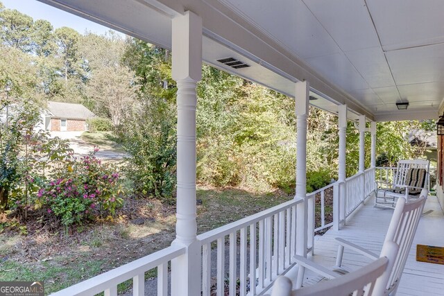 wooden deck with a porch