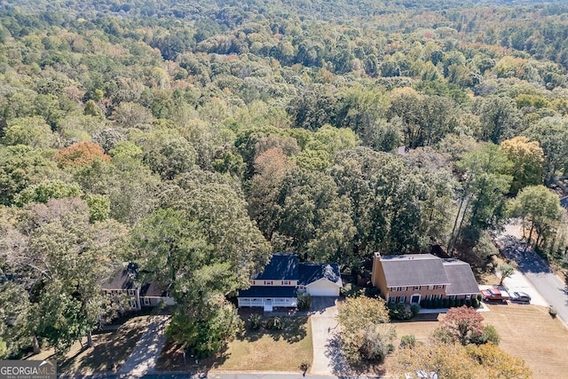 aerial view featuring a wooded view