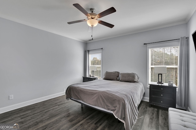 bedroom with dark wood-type flooring, ceiling fan, and crown molding