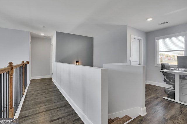 hallway featuring dark wood-type flooring