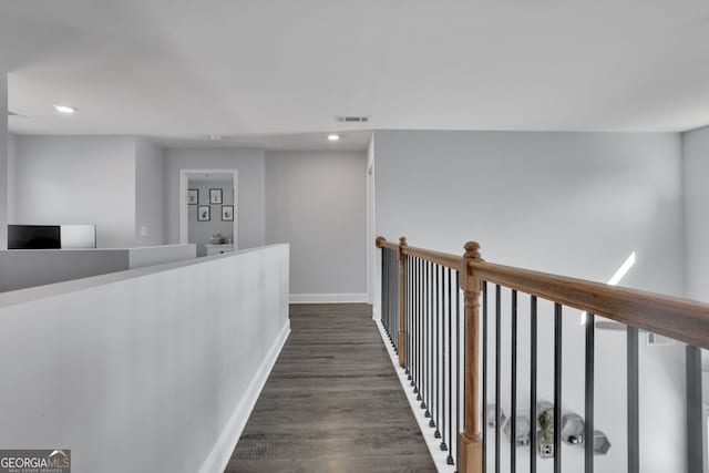 hallway with dark wood-type flooring