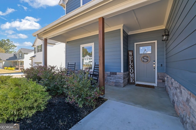 property entrance featuring covered porch