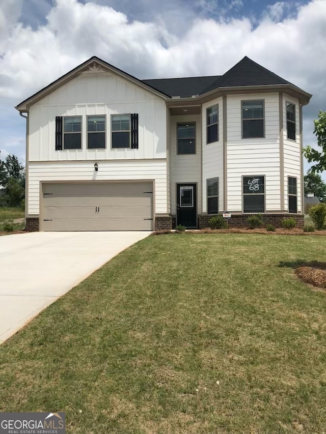 view of front of home featuring a garage, brick siding, concrete driveway, a front lawn, and board and batten siding