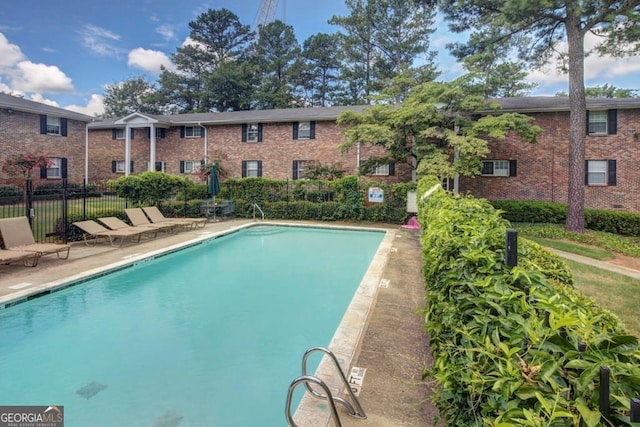 view of swimming pool with a patio area