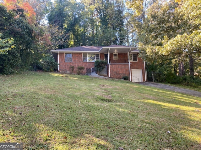 single story home featuring a garage and a front yard