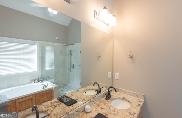 bathroom with vanity and independent shower and bath