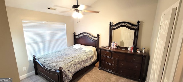 bedroom featuring ceiling fan and light colored carpet