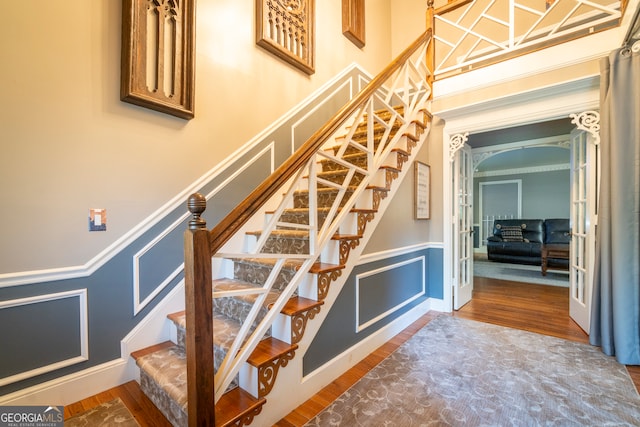 stairs with wood-type flooring