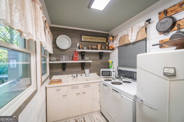 kitchen with white cabinets and white appliances