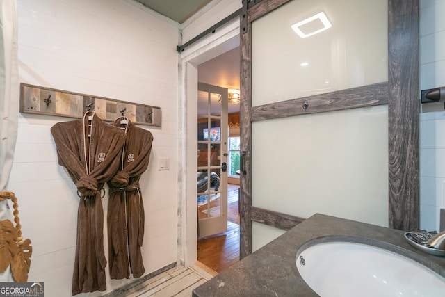 bathroom featuring vanity and hardwood / wood-style floors