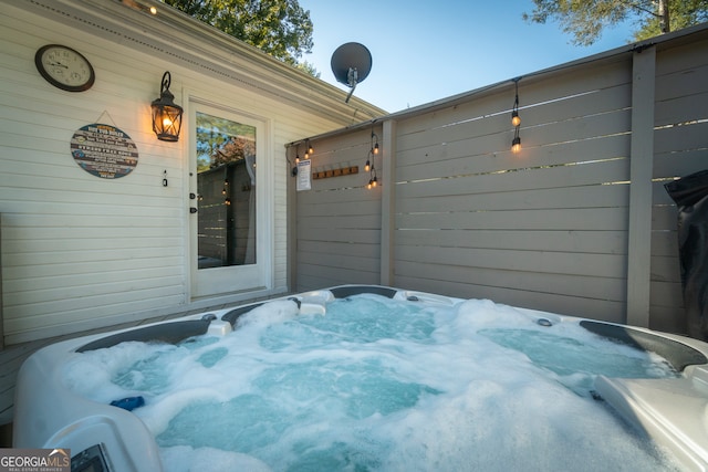 view of patio with a hot tub