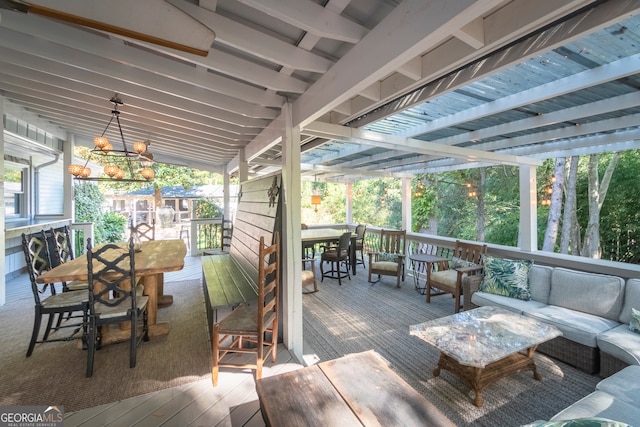 wooden deck with an outdoor living space