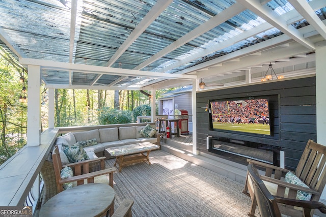 exterior space with a wooden deck and outdoor lounge area