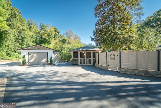 view of front of house featuring an outbuilding and a garage